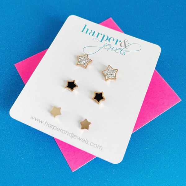 this is an image of our star earrings 3 pack on a blue and pink background