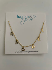 This is an image of RAQUEL hanging name necklace on a white background