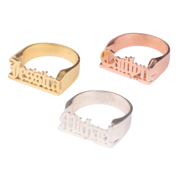 This is an image of our nameplate rings in gold, rose gold and silver on a white background