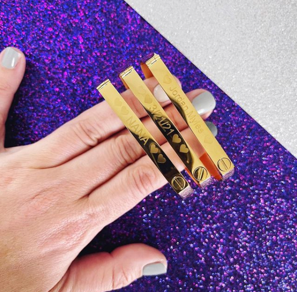 three screw bangle bracelets on purple glitter