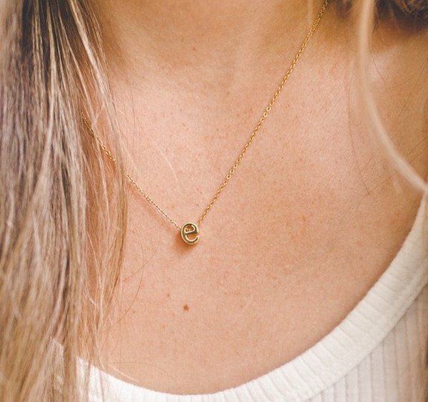 This is an image of our mini letter necklace on our model
