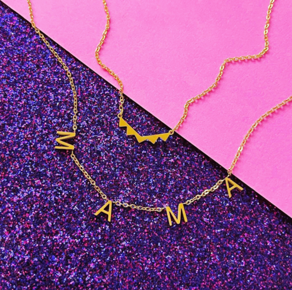 this is an image of our mama necklace layered with our dainty triangle necklace